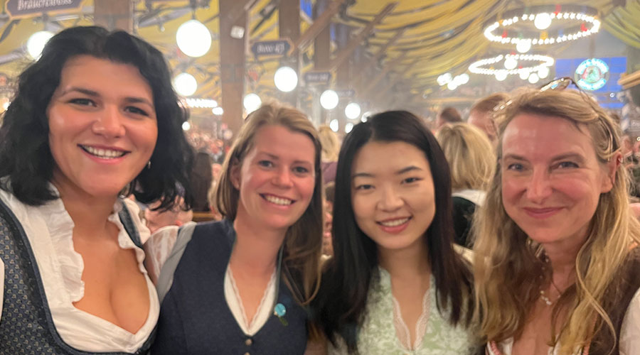 A selfie of a woman wearing a dirndl, the traditional Bavarian dress, at the Oktoberfest.